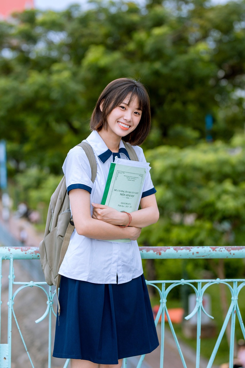 Smiling student with books